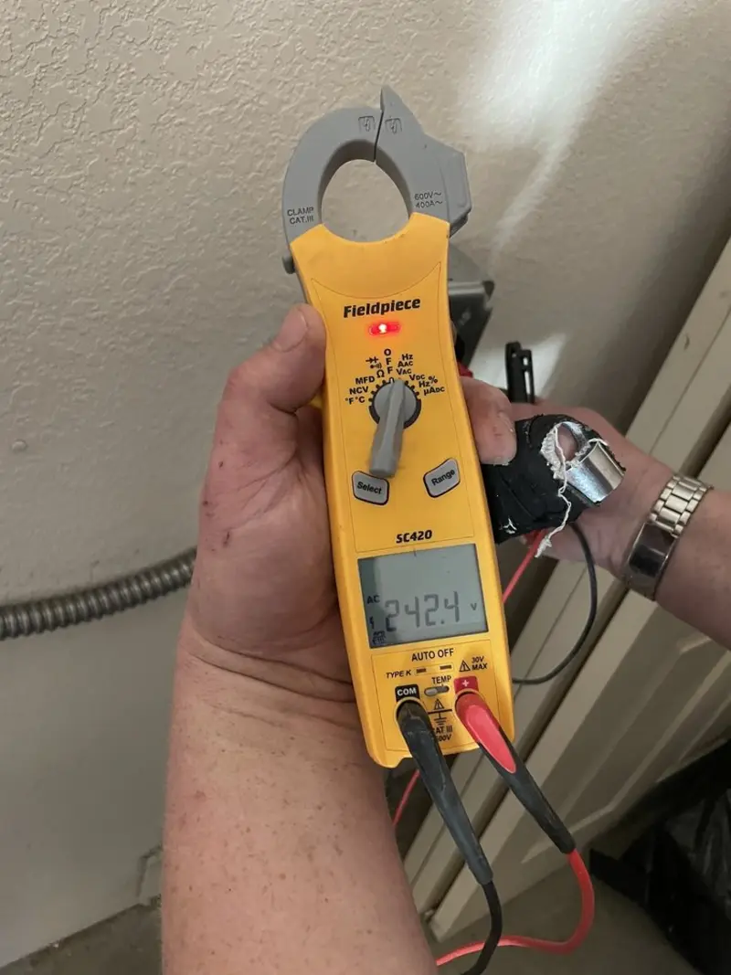 Voltage testing with clamp meter during Outlet Installation in Gaithersburg
